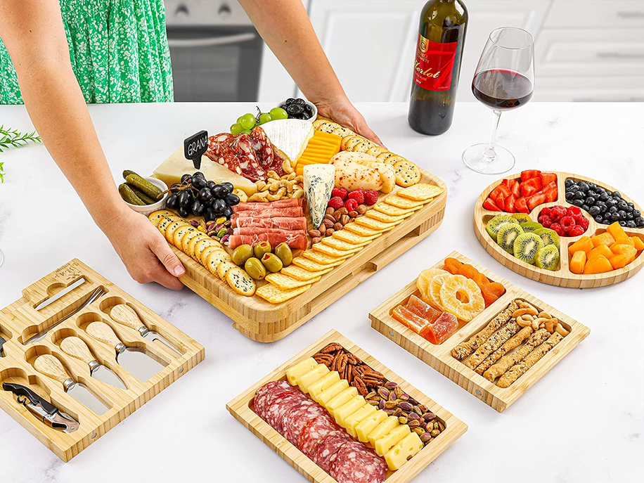 Bamboo Cheese Board Deluxe Set with Pull Out Trays, Fruit Tray, Complete Cutlery Set, and 2 Ceramic Bowls